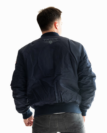 Back view of a man wearing the Top Gun® MA-1 bomber jacket #color_navy